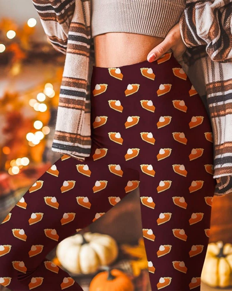 Person wearing maroon leggings patterned with repeated images of pumpkin pie slices.