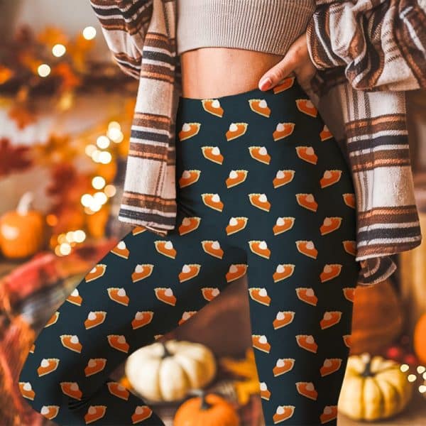 Dark Leggings Patterned With Repeated Images Of Pumpkin Pie Slices.