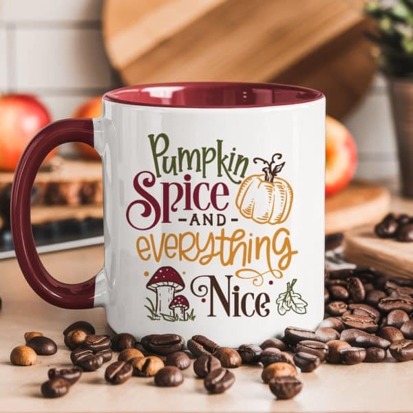 White Mug With Burgundy Interior, Featuring Autumnal Text And Graphics That Read Pumpkin Spice And Everything Nice.