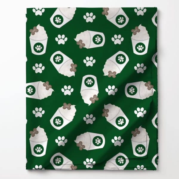 Green Fabric With A Repeating Pattern Of Coffee Cups Topped With Whipped Cream And A Dog Bone, And Paw Prints.