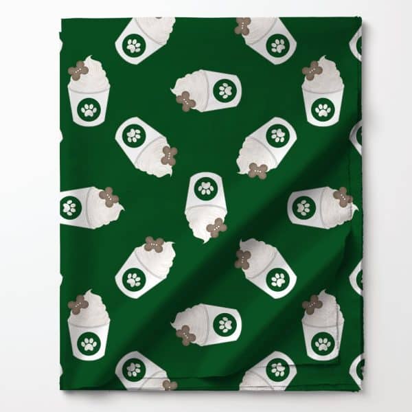 Dark Green Fabric With A Repeating Pattern Of White Cups Of Frothy Beverage Topped With A Brown Dog Treat. Each Cup Has A Paw Print.