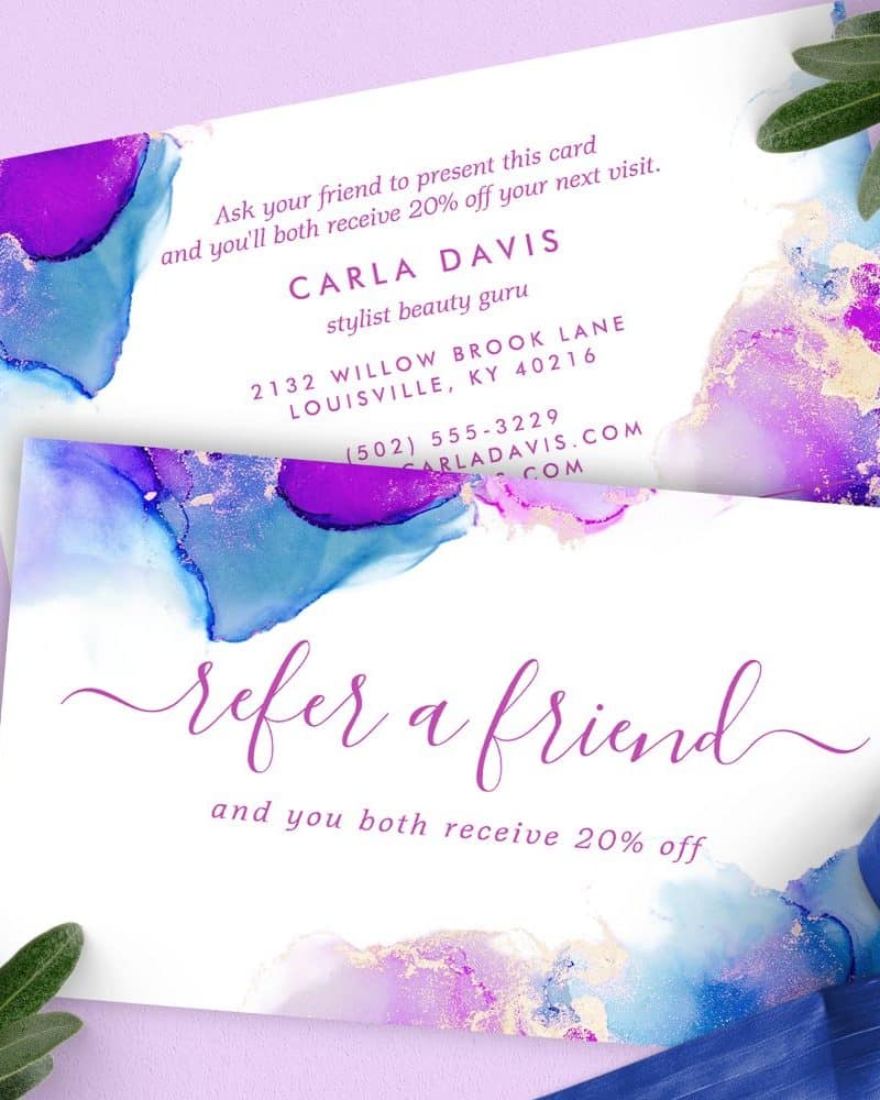 Refer a friend and receive 20% off your next visit with stylist Carla Davis. The card features an abstract purple and blue watercolor design.