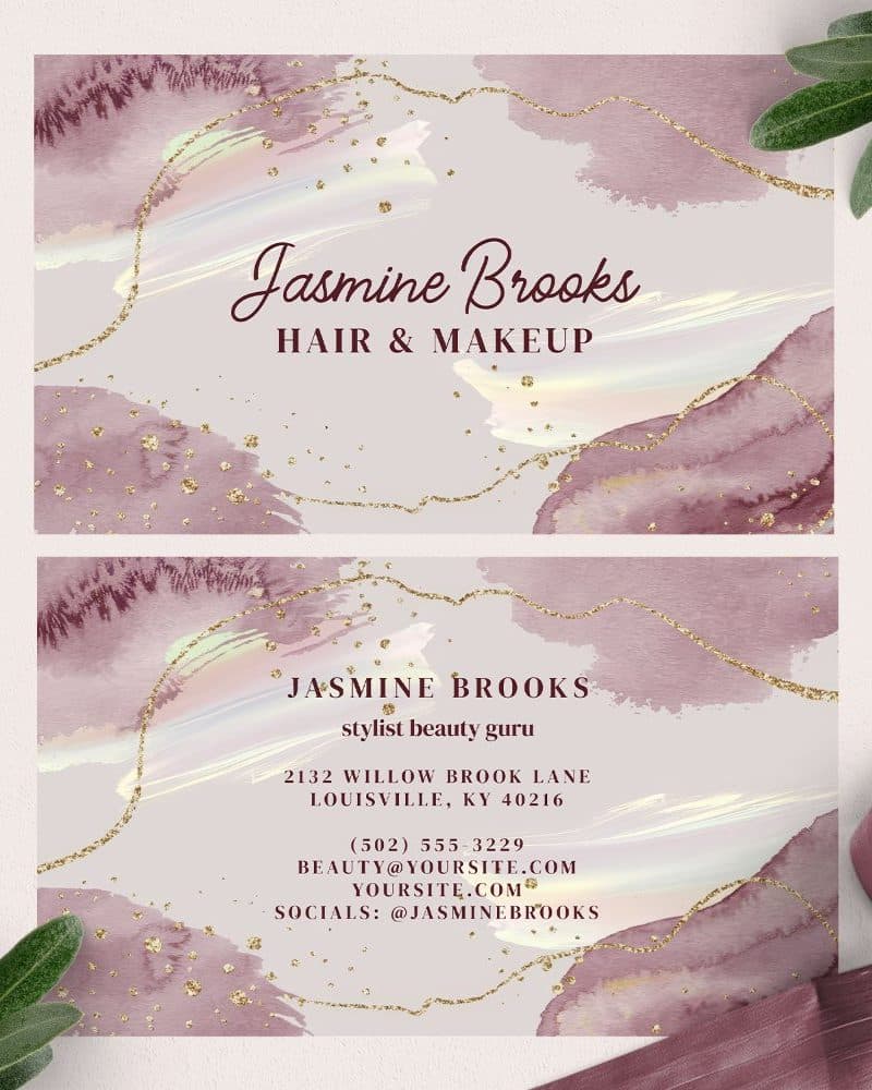 Two business cards for Jasmine Brooks, hair and makeup stylist, featuring a watercolor design in shades of mauve and gold.