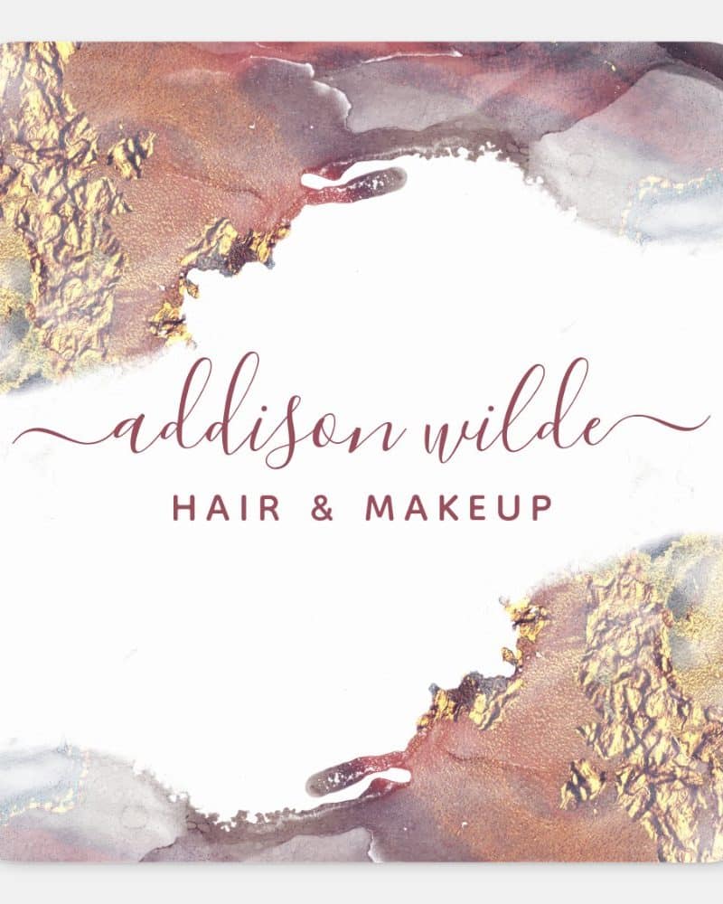 Business card for Addison Wilde Hair & Makeup featuring a watercolor design in shades of rose gold and gray.