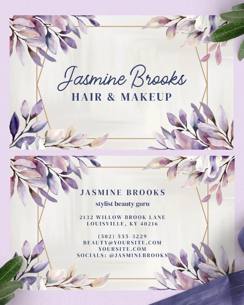 Two elegant business cards featuring watercolor purple floral designs and gold geometric frames, with Jasmine Brooks's hair and makeup business information.