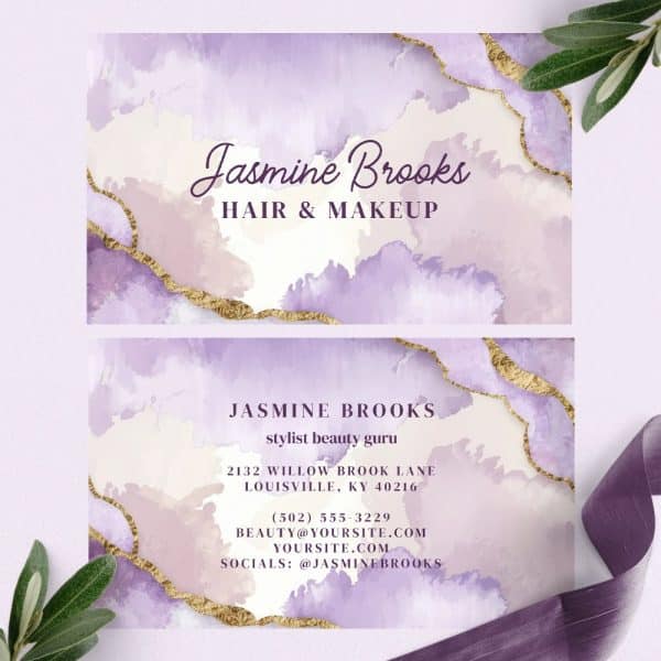 Two Business Cards For Jasmine Brooks, Hair And Makeup Stylist, Featuring A Purple And Gold Watercolor Design.