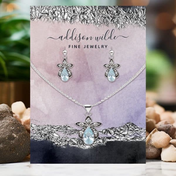 Aquamarine Jewelry Set: Necklace And Earrings With Pear-Shaped Stones And Floral Accents.