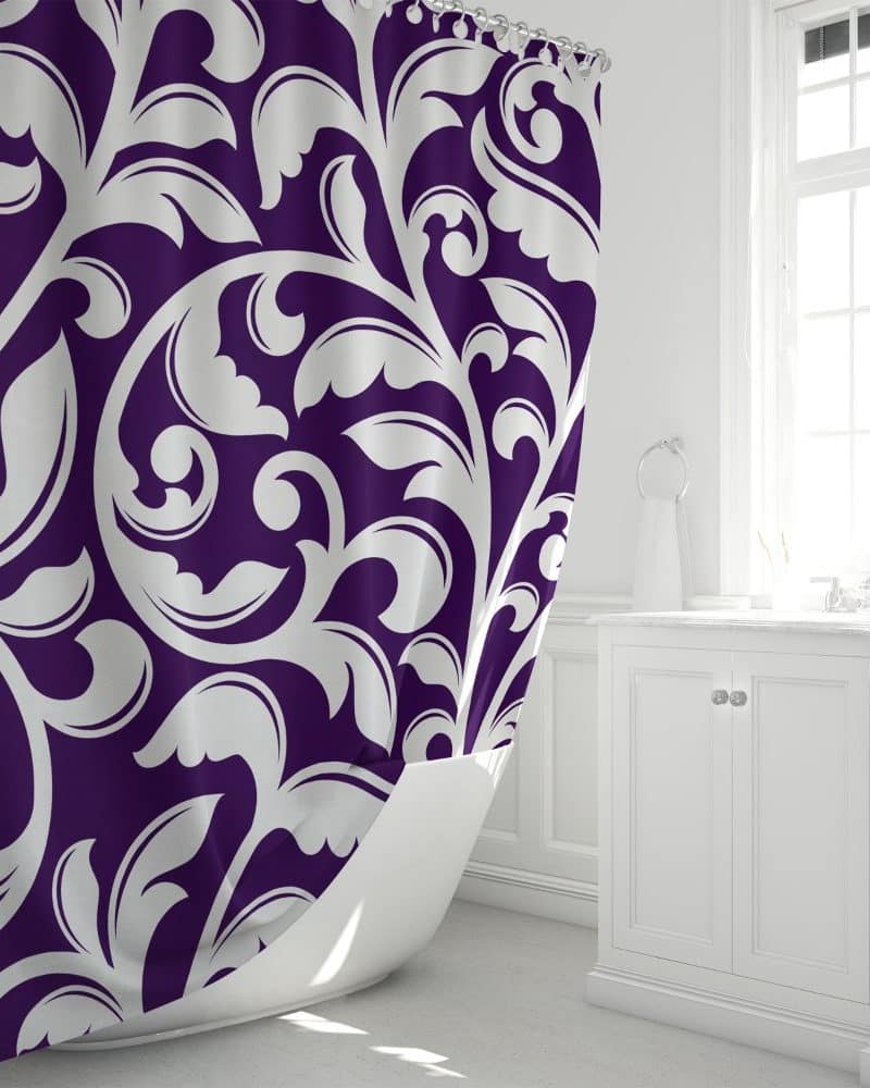 Purple shower curtain with a white damask pattern.