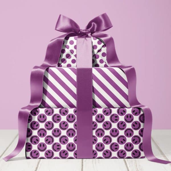 Stack Of Three Purple Wrapped Presents With A Large Purple Ribbon.