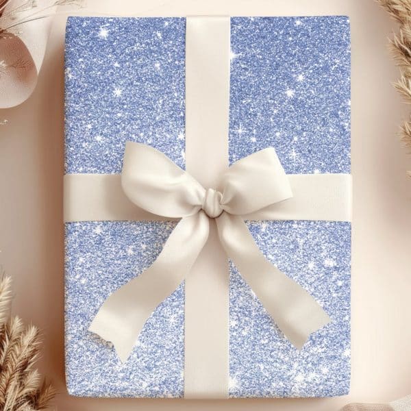 A Light Blue Glitter Gift Box With A Cream-Colored Ribbon Tied In A Bow.
