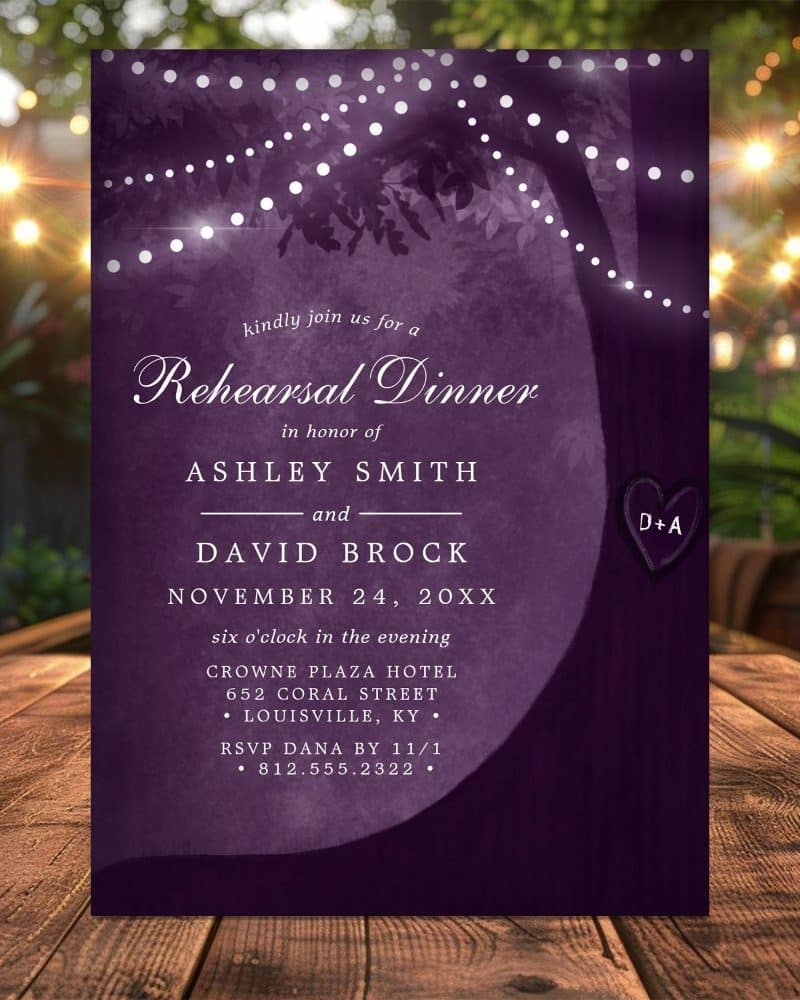 Purple rehearsal dinner invitation with a tree silhouette and string lights.