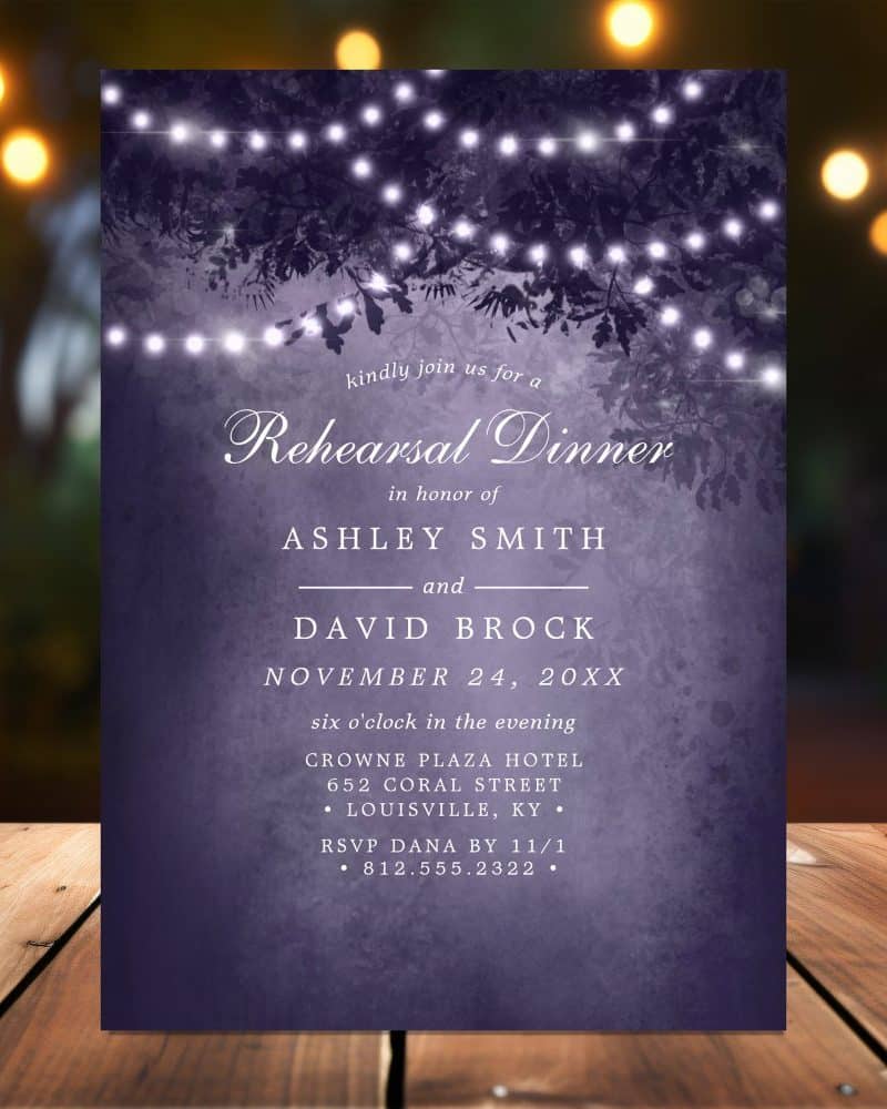 Purple Rehearsal Dinner Invitation With String Lights And Tree Branches.