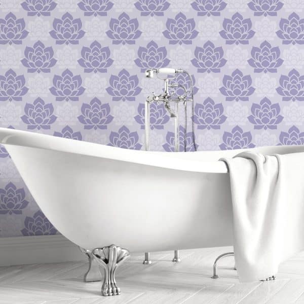 A Clawfoot Bathtub In Front Of A Lavender Floral Wall.