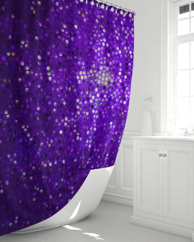 Purple shower curtain with a sparkly polka dot pattern.