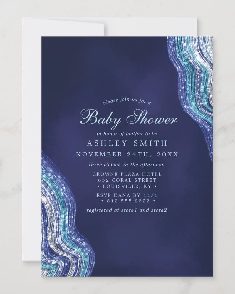 Baby shower invitation for Ashley Smith, featuring a dark blue background with teal and silver abstract design.