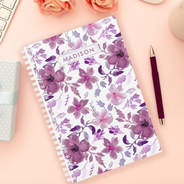 Spiral-Bound Notebook With A Purple Floral Design And The Name Madison On The Cover.