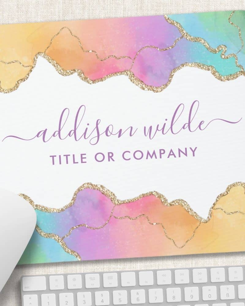Pastel rainbow mousepad with gold glitter accents and the name Addison Wilde.
