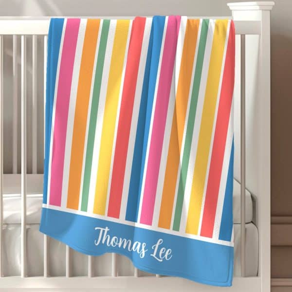 Personalized Baby Blanket With Multicolored Vertical Stripes And The Name Thomas Lee.