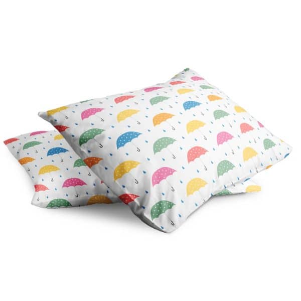 Two Pillowcases With A Pattern Of Colorful Umbrellas And Raindrops.