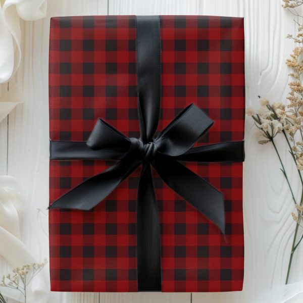Red And Black Buffalo Plaid Gift Box Tied With A Black Ribbon.