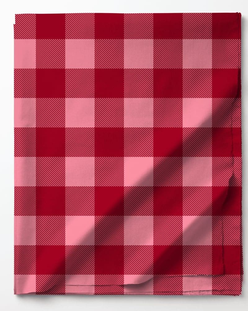 Red and pink plaid fabric folded.