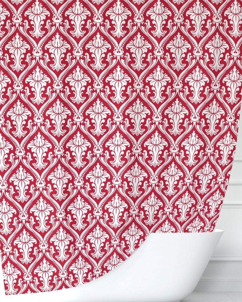 Red shower curtain with a white damask pattern.