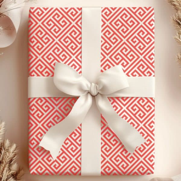 Gift Box With Coral Greek Key Pattern Wrapping Paper And White Ribbon.