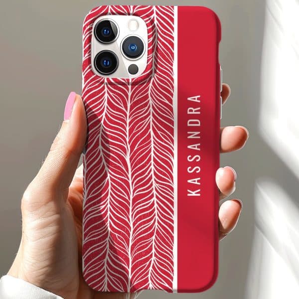 Red Iphone Case With A White Leaf Pattern And The Name Kassandra.