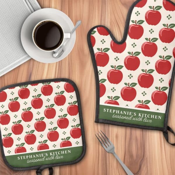 A Kitchen Oven Mitt And Pot Holder With A Red Apple Pattern And Personalized Text.