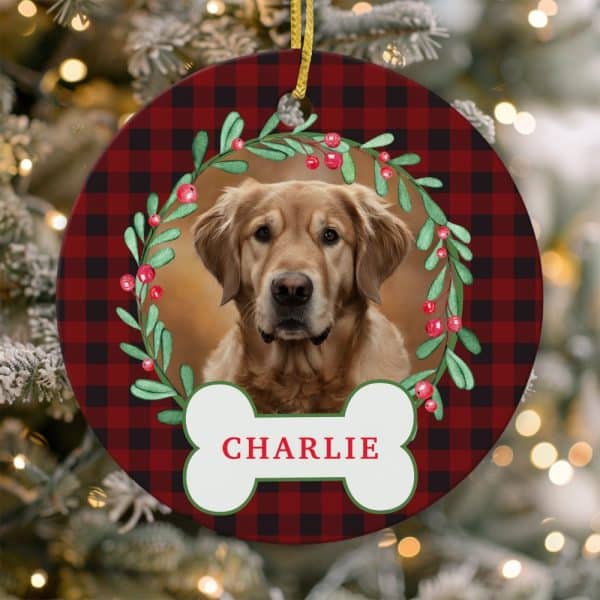 Round Christmas Ornament With Red And Black Plaid Background, Featuring A Golden Retriever In A Holly Wreath, And The Name Charlie On A Bone-Shaped Tag.
