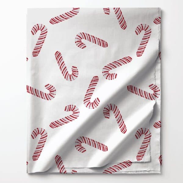 White Fabric With A Repeating Pattern Of Red And White Candy Canes.