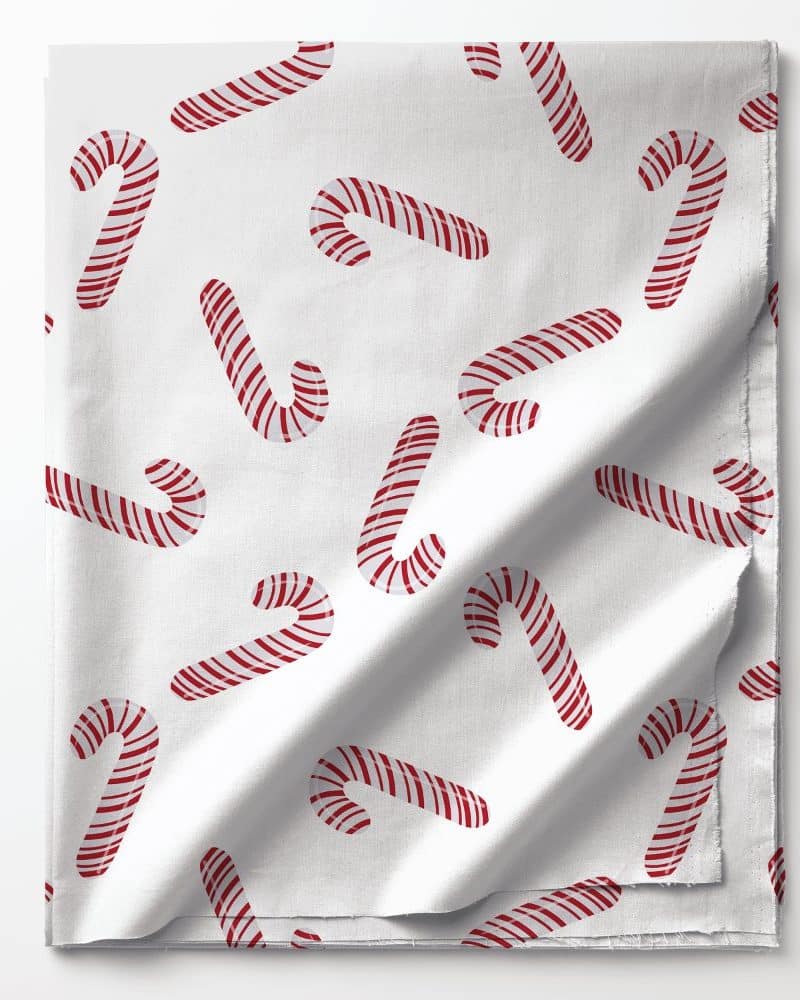 White fabric with a repeating pattern of red and white candy canes.