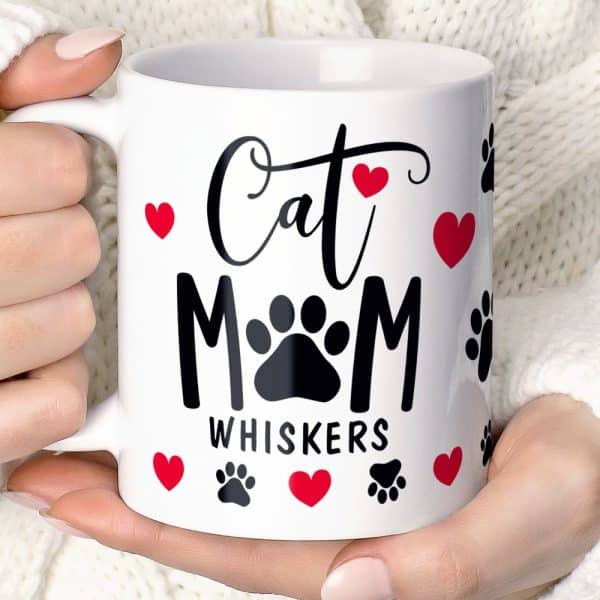 White Coffee Mug With Cat Mom Whiskers Design. The Design Includes Paw Prints And Hearts.