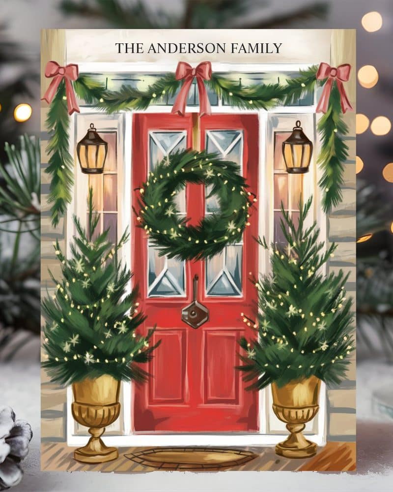 A Christmas card illustration of a red front door decorated with a wreath, garland, and potted trees. The Anderson family name is at the top.