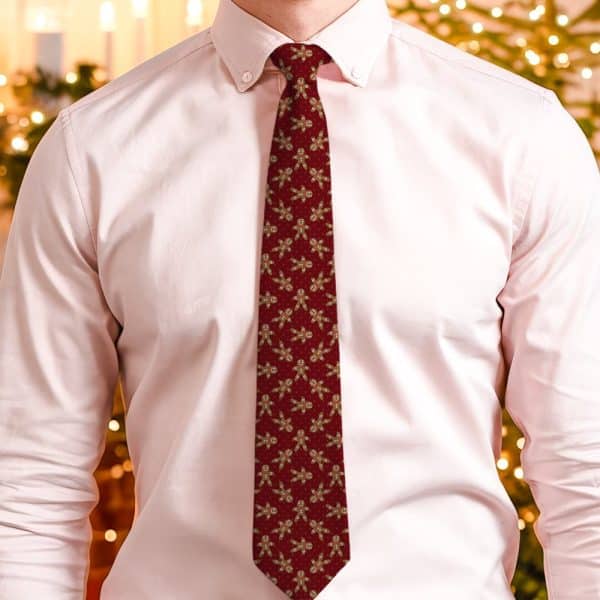 Red Tie With A Repeating Pattern Of Gingerbread Men.