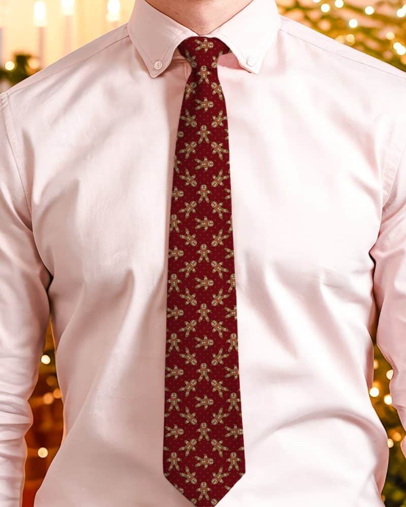 Red tie with a repeating pattern of gingerbread men.