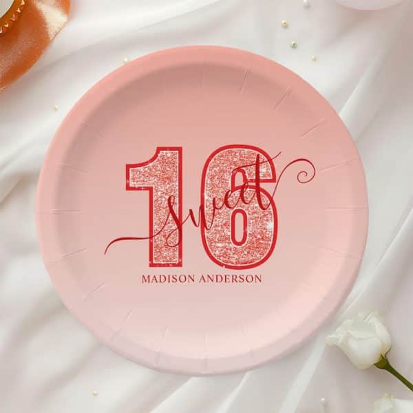 Pink Paper Plate With Red Glitter Sixteen And Sweet Sixteen Text. Madison Anderson Is Printed Below.