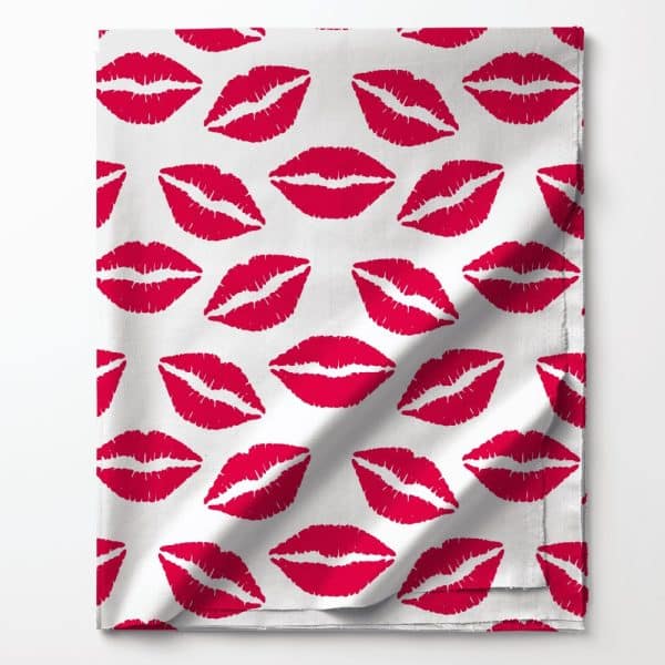 White Fabric With A Repeating Pattern Of Red Lipstick Kisses.