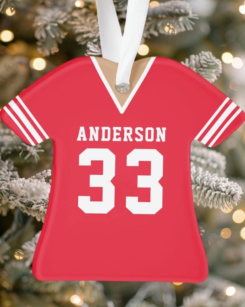 Red personalized football jersey Christmas ornament with the name Anderson and number 33.