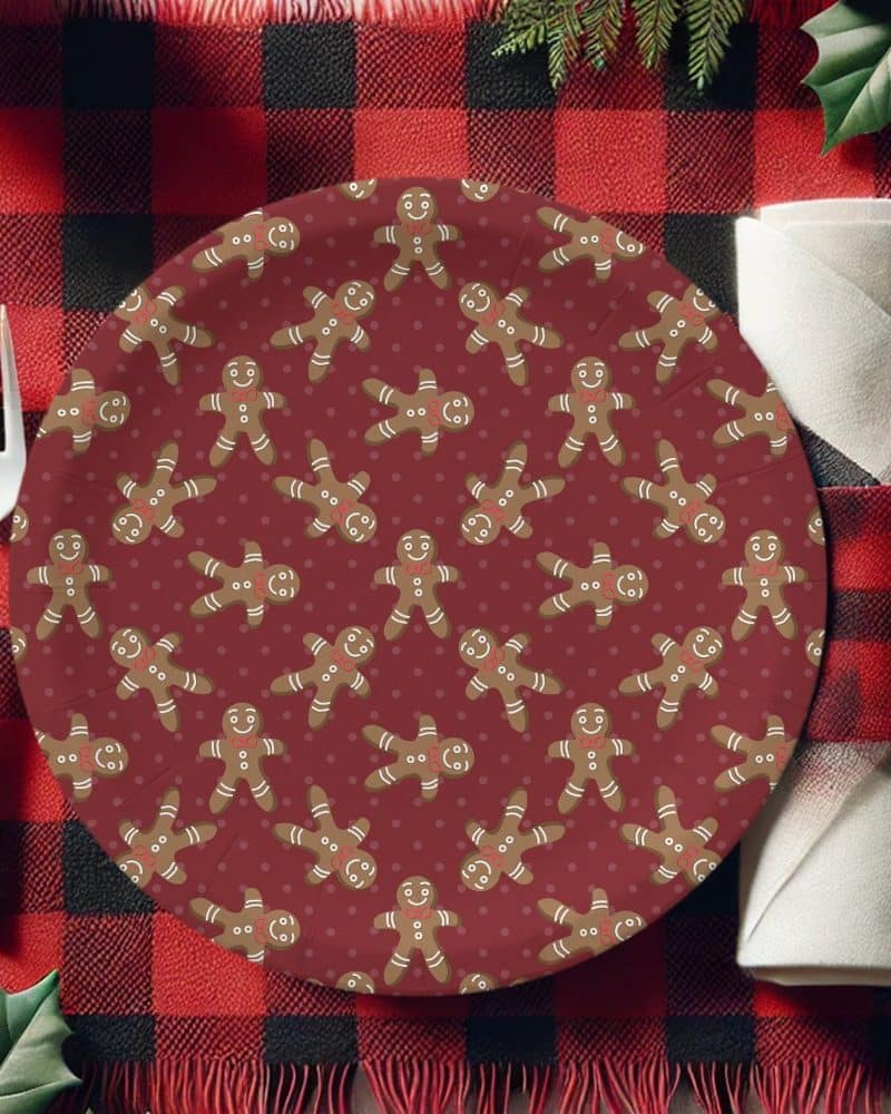 Red paper plate with a repeating pattern of gingerbread men.