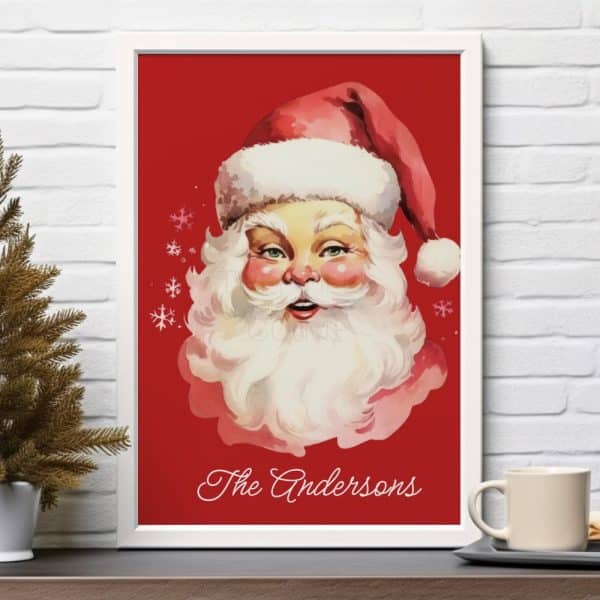 Framed Illustration Of Santa Claus'S Face Against A Red Background, With The Name Andersons At The Bottom.