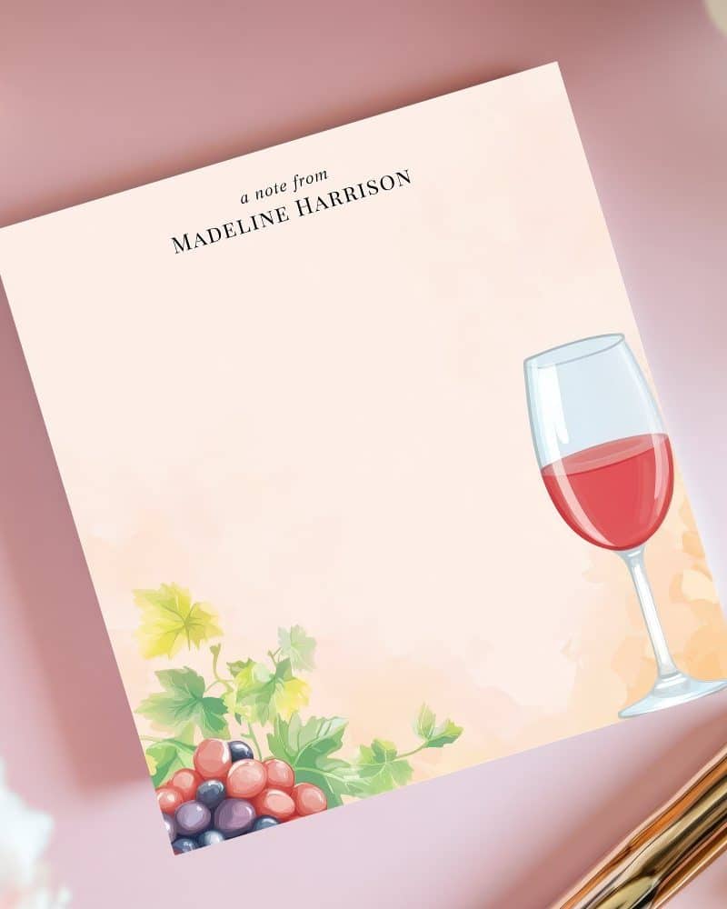 Personalized notepad featuring a glass of red wine and grapes.