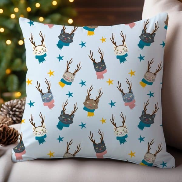 Light Blue Throw Pillow With A Repeating Pattern Of Cats Wearing Antlers And Scarves.