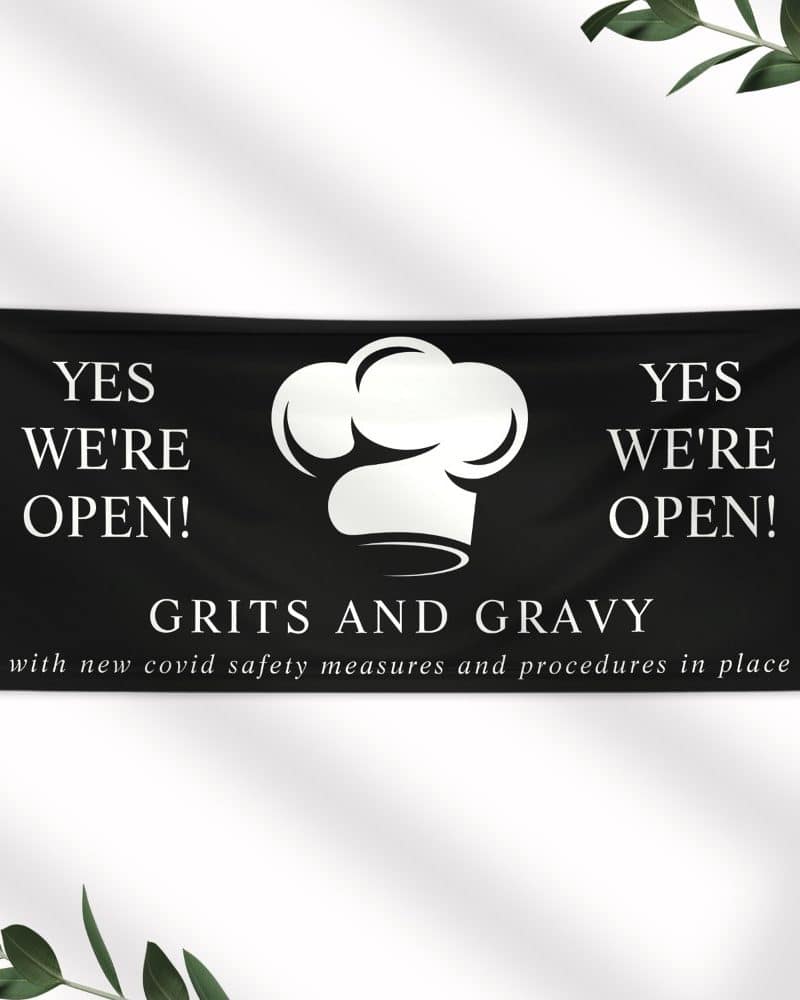 Black banner announcing Grits and Gravy restaurant is open, with a chef's hat graphic.
