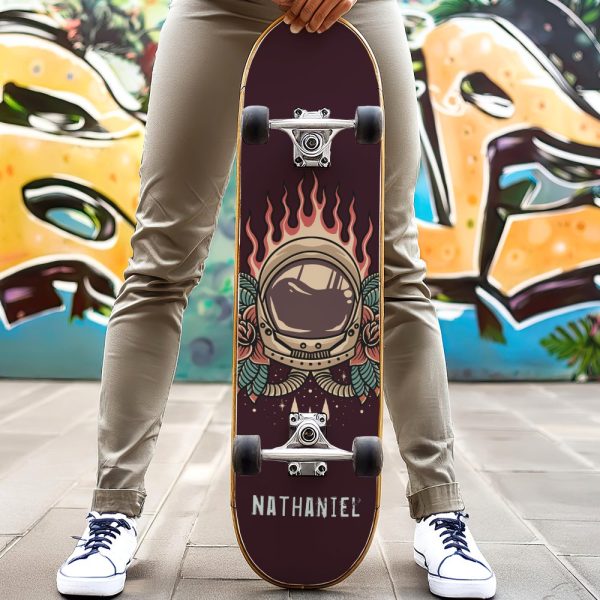 Person Holding A Skateboard With An Astronaut Helmet Graphic.