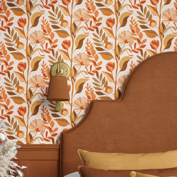 Orange And Brown Floral Wallpaper On A Bedroom Wall, Partially Visible Behind A Brown Headboard.