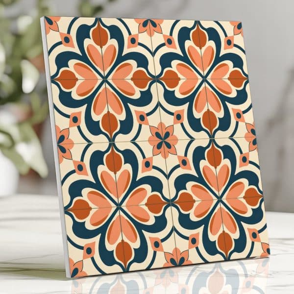A Square Tile With A Repeating Pattern Of Stylized Coral And Rust-Colored Flowers On A Navy Blue And Cream Background.