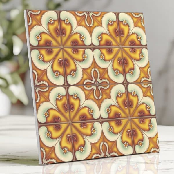 Square Tile With A Repeating Pattern Of Stylized Flowers In Shades Of Yellow, Orange, And White.