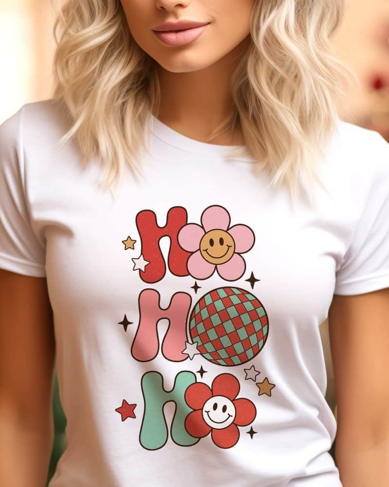 White t-shirt with a retro design featuring the words Ho Ho Ho, flowers, and a disco ball.