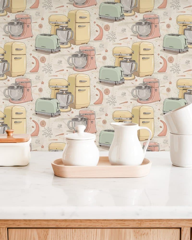 Kitchen counter with pastel-colored kitchen appliances wallpaper and white tea and coffee set.